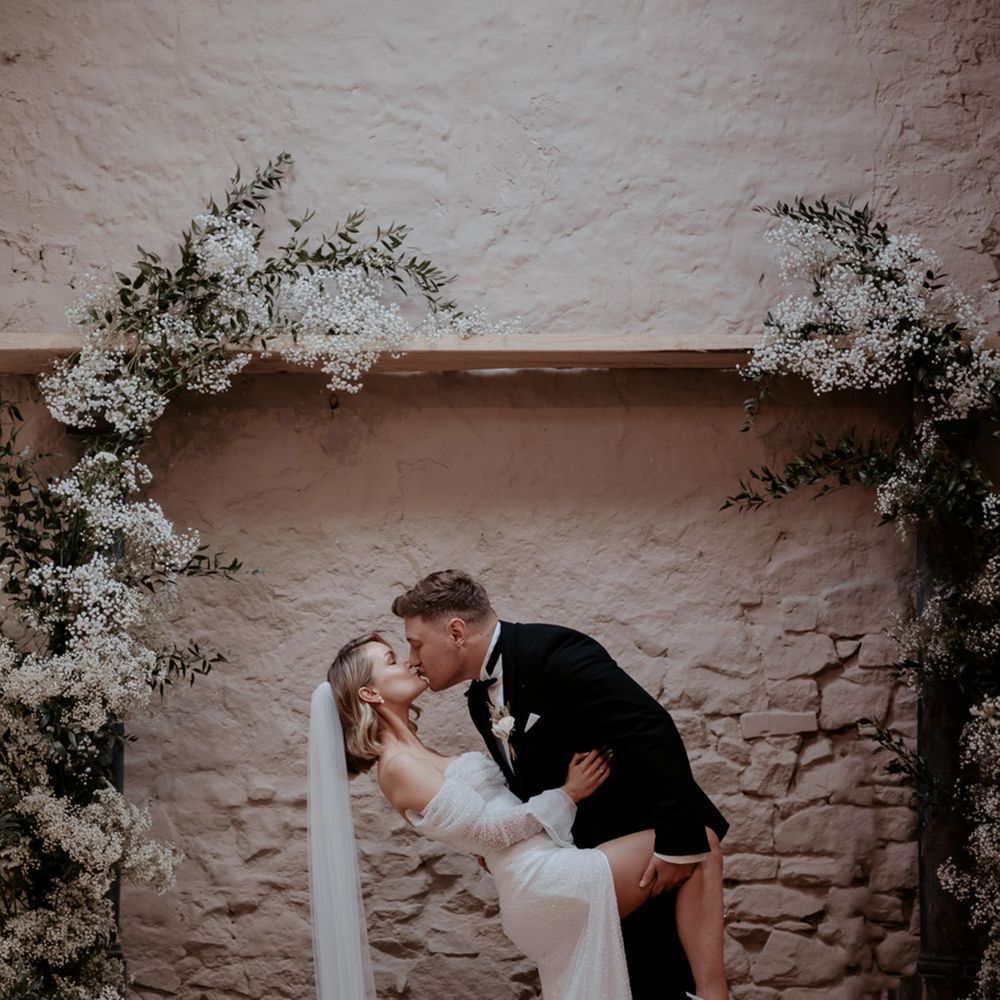 Wyresdale Park wedding with the bride and groom sharing a passionate kiss at their classic and traditional wedding 