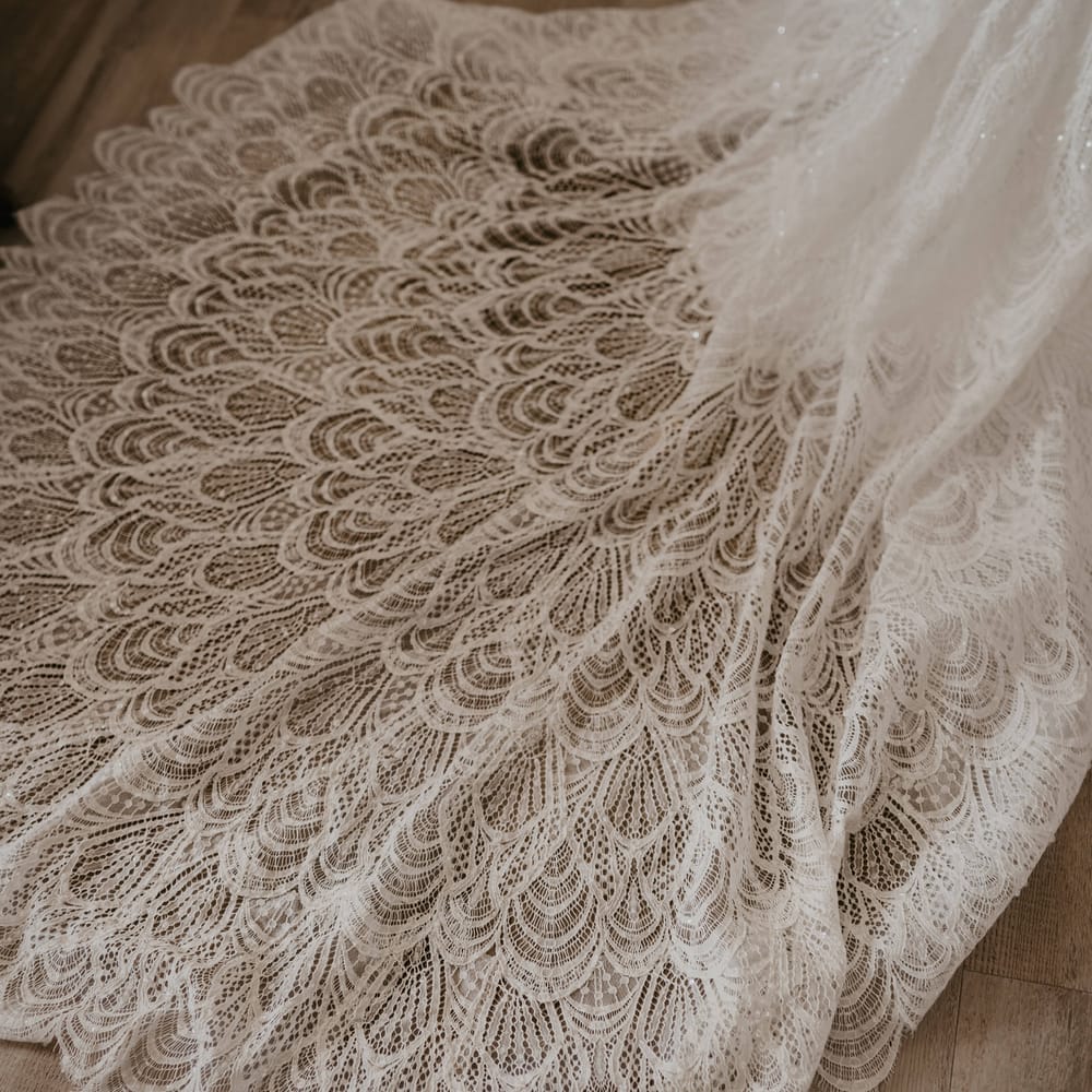 Intricate bridal train featuring lace detailing and sequins throughout | Mark Bamforth Photography