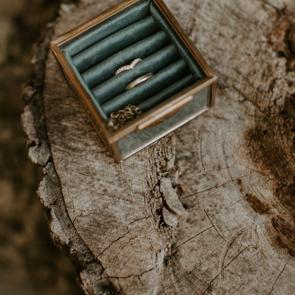 Wedding rings with glass box with green velvet cushion 