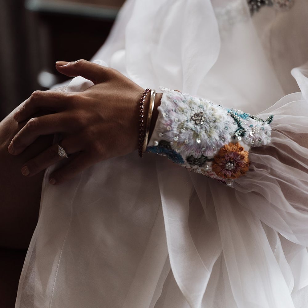 Embroidered floral cuff sleeve of bespoke Victoria Sanders wedding dress