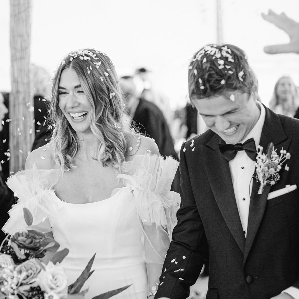 Bride and groom confetti moment