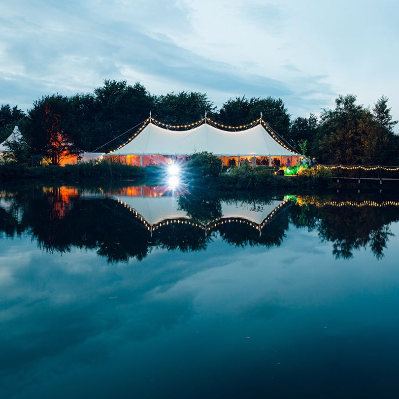 Marquee wedding with festoon lighting