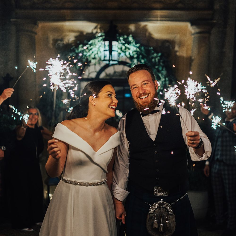 Sparkler exit at Foxhill Manor with the bride in an off the shoulder wedding dress