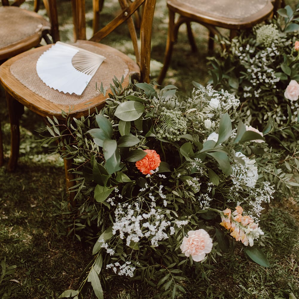 Wooden chairs with fans for guests