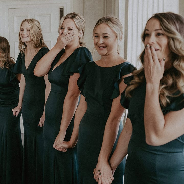 Bridesmaids in bottle green short sleeved bridesmaids dresses, both V neck and high neck 