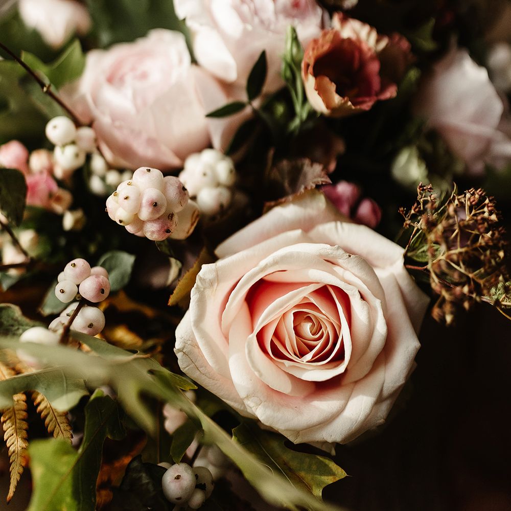 Pink garden roses and other autumnal flowers for wedding bouquet