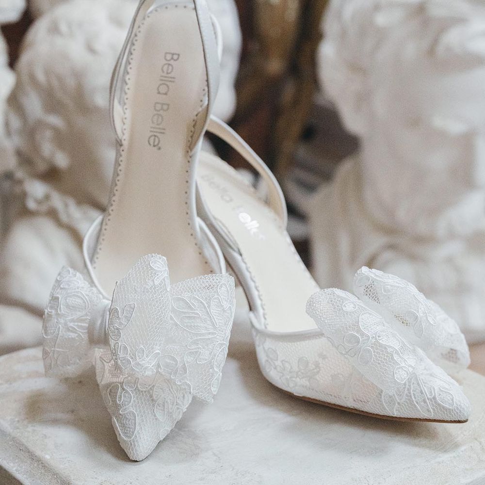 Bella Belle slingback sheer lace wedding shoes with bow and stiletto heel on pedestal