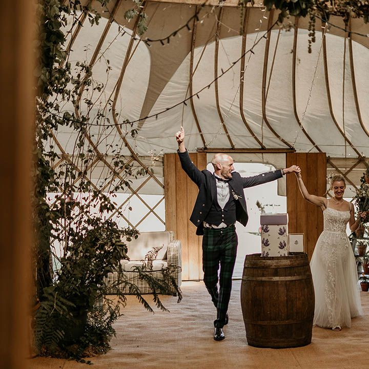 Camp Katur wedding venue with a yurt for the wedding reception decorated with lots of greenery and foliage for enchanted forest vibe 