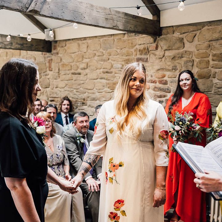 Lesbian wedding with two brides standing facing each other at the The Parlour, Blagdon wedding 