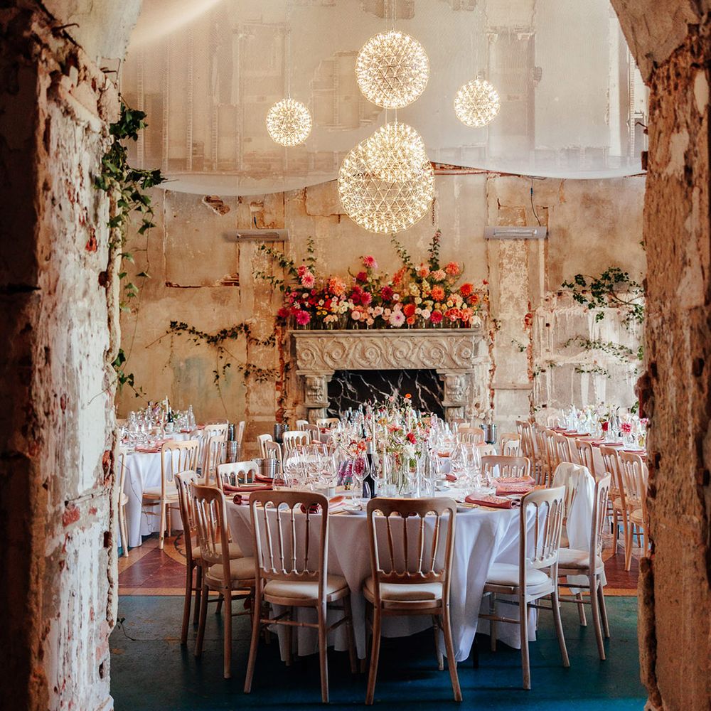 Pink wedding tablescapes at The Grange Hampshire with delicate light fixtures 