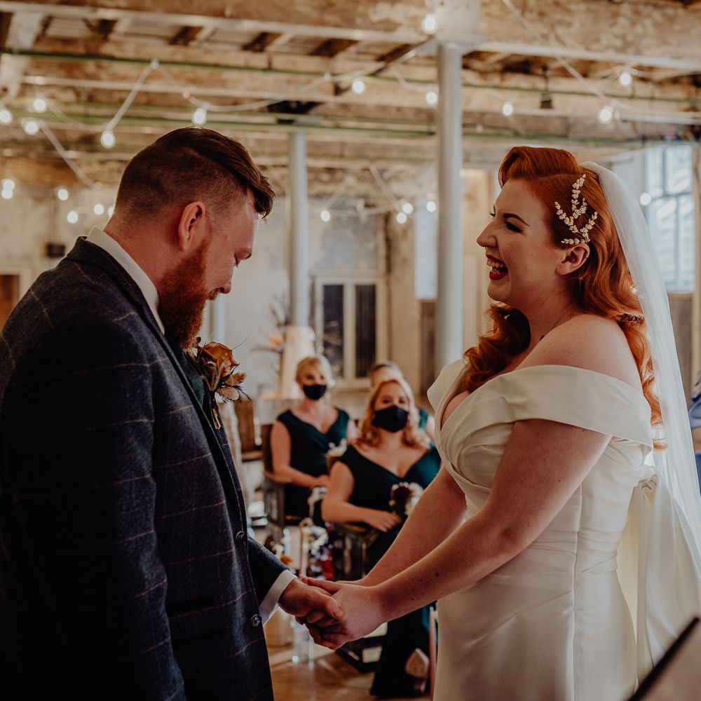 Bride and groom exchanging vows at Holmes Mill, Liverpool 