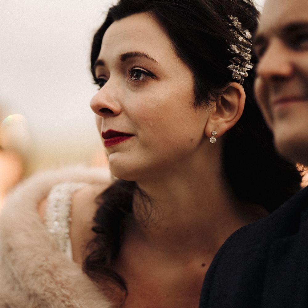 Emotional bride with red lipstick and fur stole 