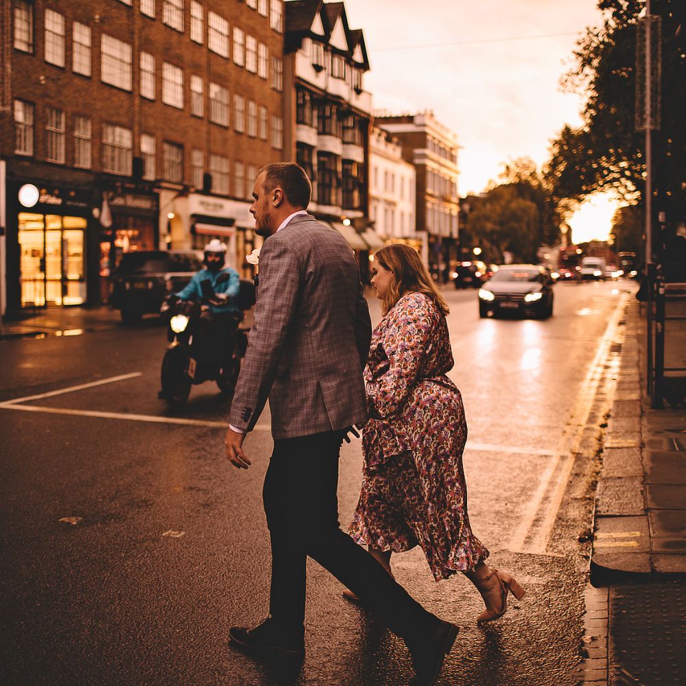 Bride & groom walk across the road in Chelsea after wedding ceremony