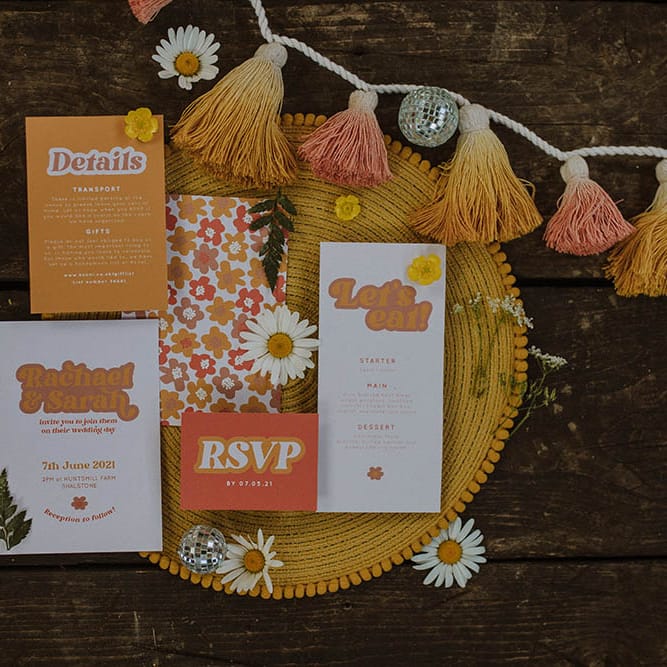 Sixties wedding stationery suite with retro font, tassel decor and mirror balls 