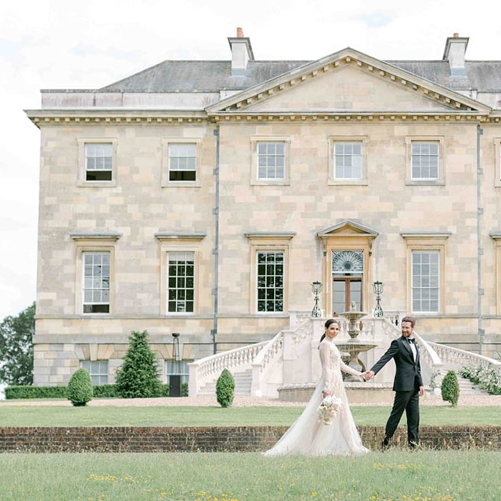 Elegant wedding at Botley's Mansion in Surrey with groom in a tuxedo and bride in a long sleeve wedding dress