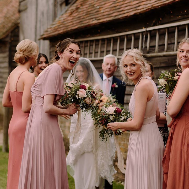 Bridesmaids in mismatched dresses at White Pond Farm wedding
