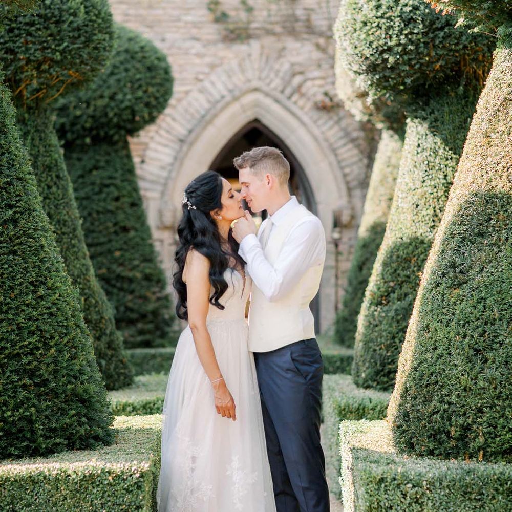 Bride & groom kiss outdoors on their wedding day