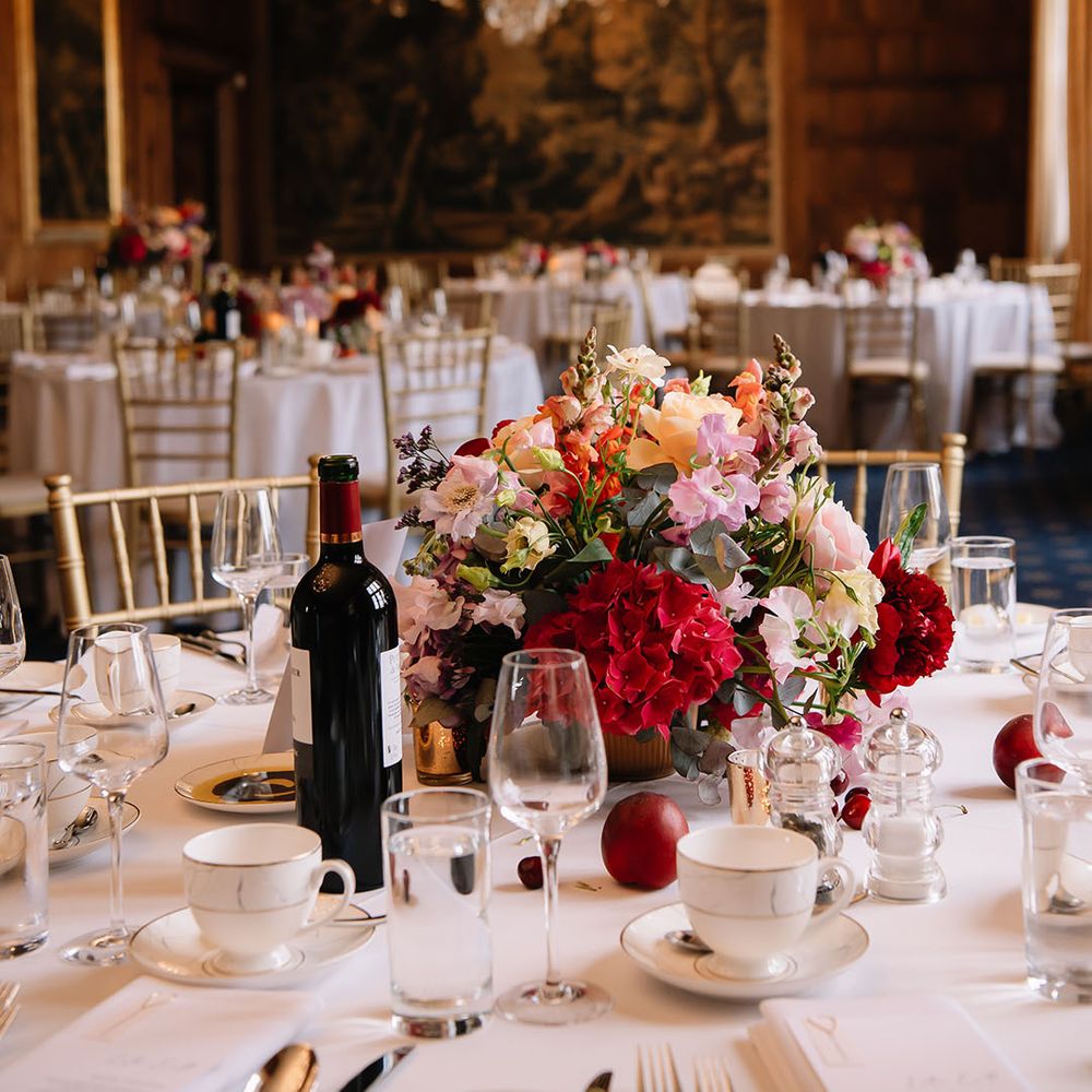 North Mymms Park wedding venue with vibrant flower centrepieces with hydrangeas and roses 