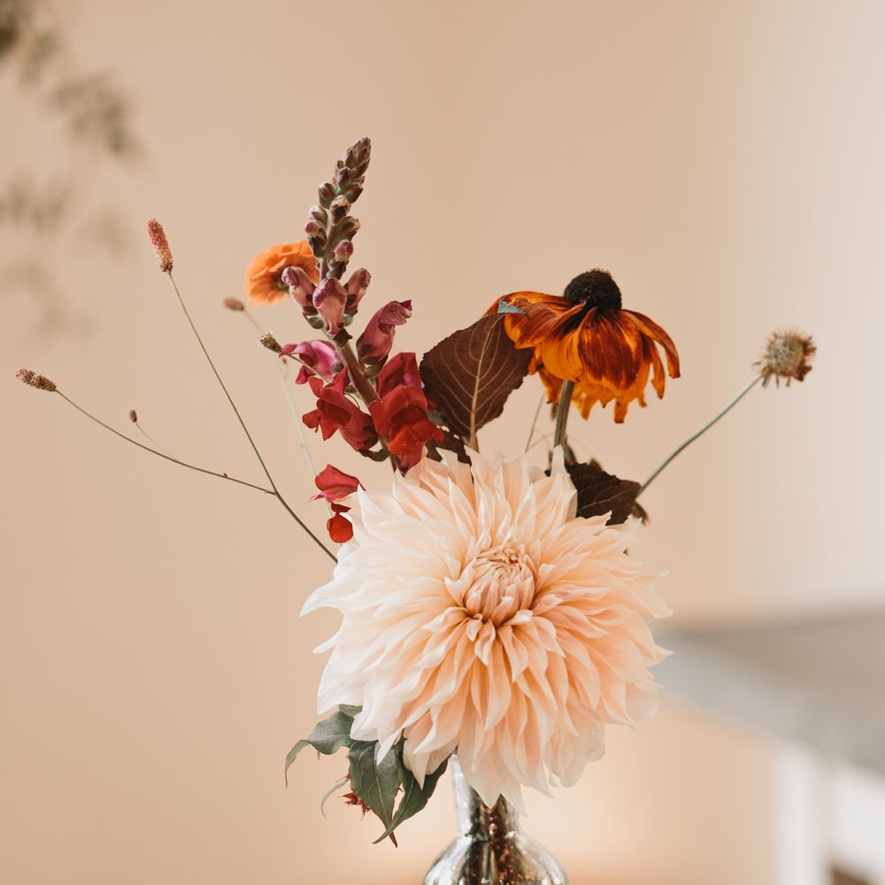 dahlia wedding flowers in bottles 
