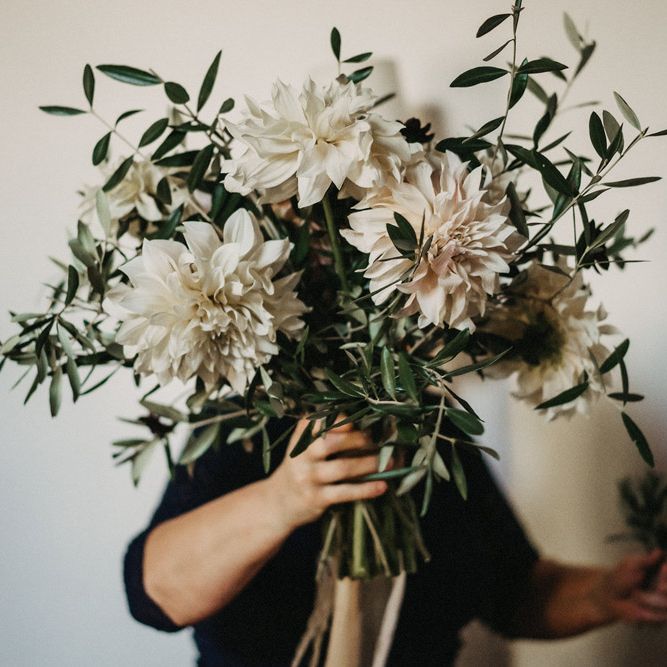 A huge boquet of olive branches and dahlias