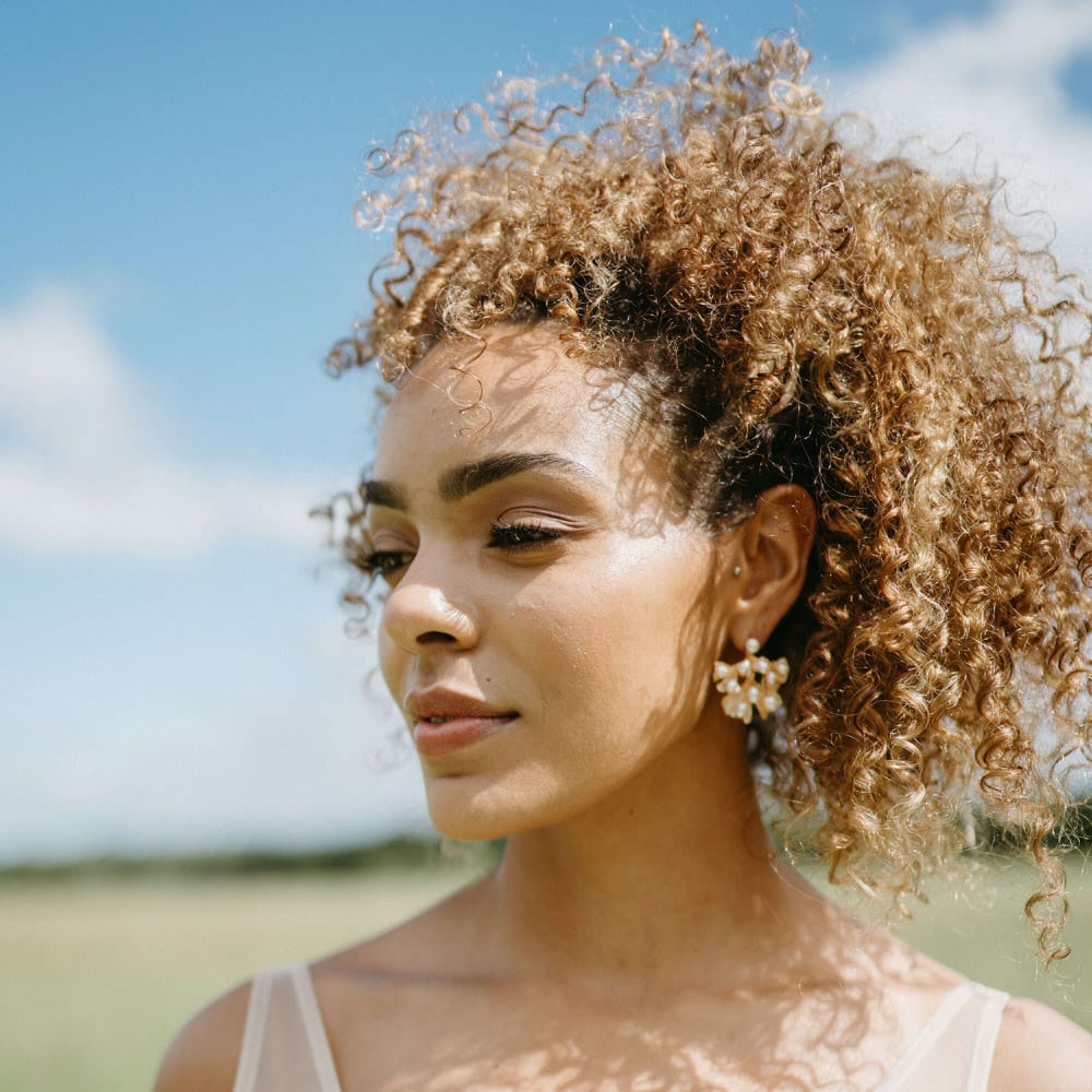 Natural wedding makeup and natural curly wedding hair for boho inspired bridal look
