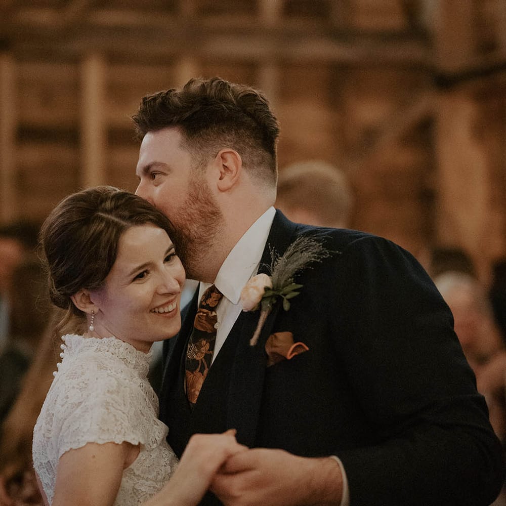 Bride and groom share a moment at The Barns at Redcoats