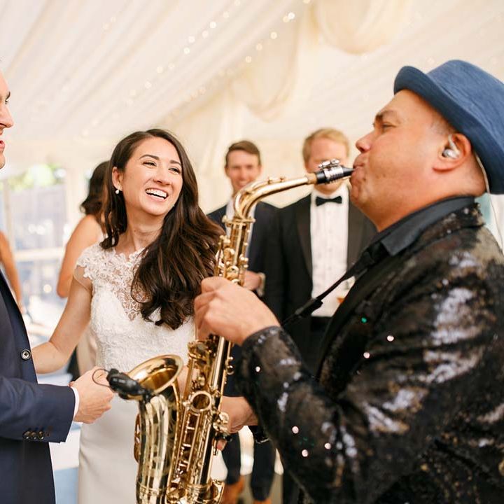 wedding entertainment saxophonist at evening reception 