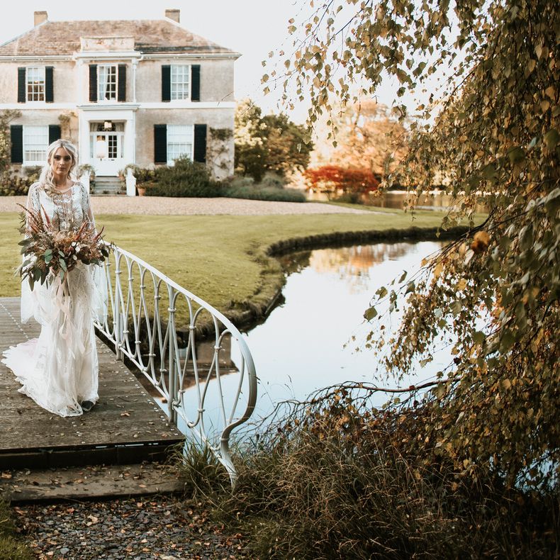 Bride arrives holding a pampas grass bouquet
