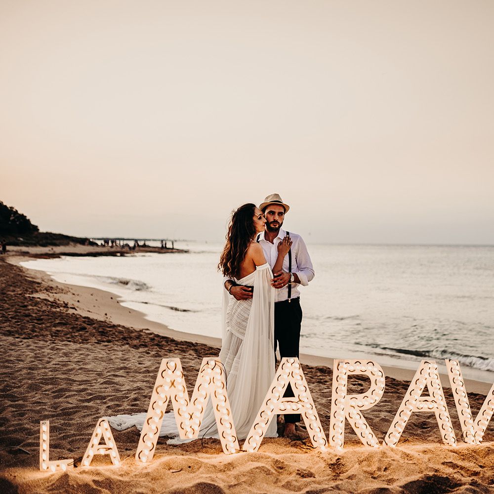 Light Up letters on beach at Puglia wedding