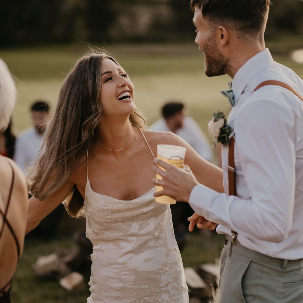 Bride & groom dance and smile during reception on their wedding day | Mark Bamforth Photography