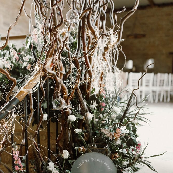 frosted acrylic wedding welcome sign resting on the steps at Hooton Tithe Barn shoot 