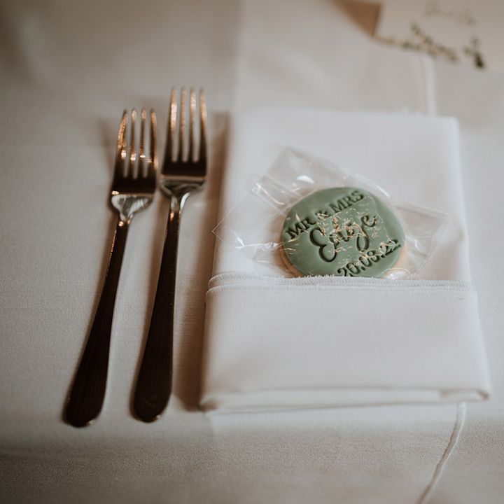 Green iced biscuit wedding favours with personalised details 
