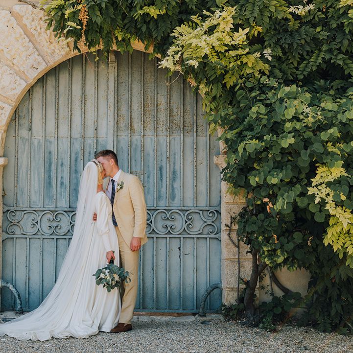 Château de Malliac destination wedding with bride in a long sleeve Emma Beaumont wedding dress and groom in a beige suit