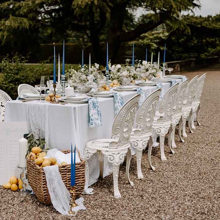 outdoor wedding tables cape with blue, white and yellow table decorations