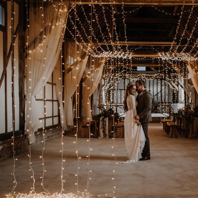White LED string lighting for cosy boho barn wedding 