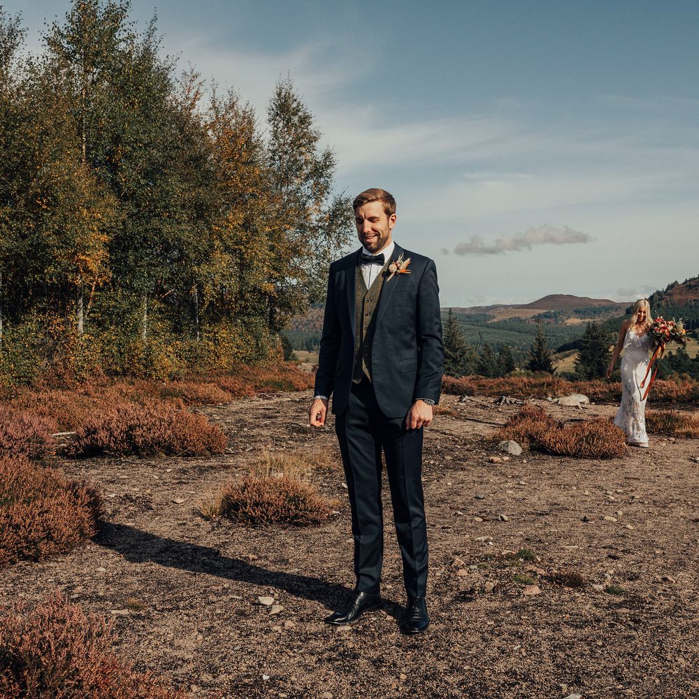 Bride & groom walk through the Scottish countryside together on wedding day