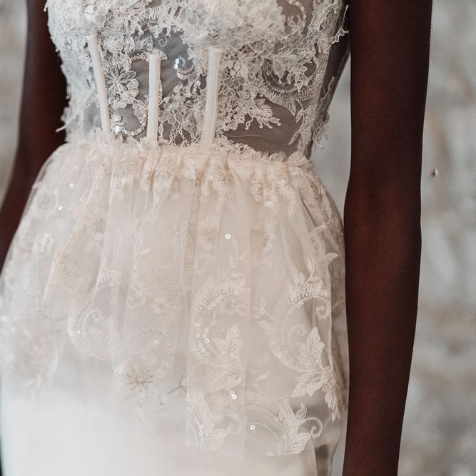 Fitted lace bodice and peplum detail on Felisiti Greis wedding dress