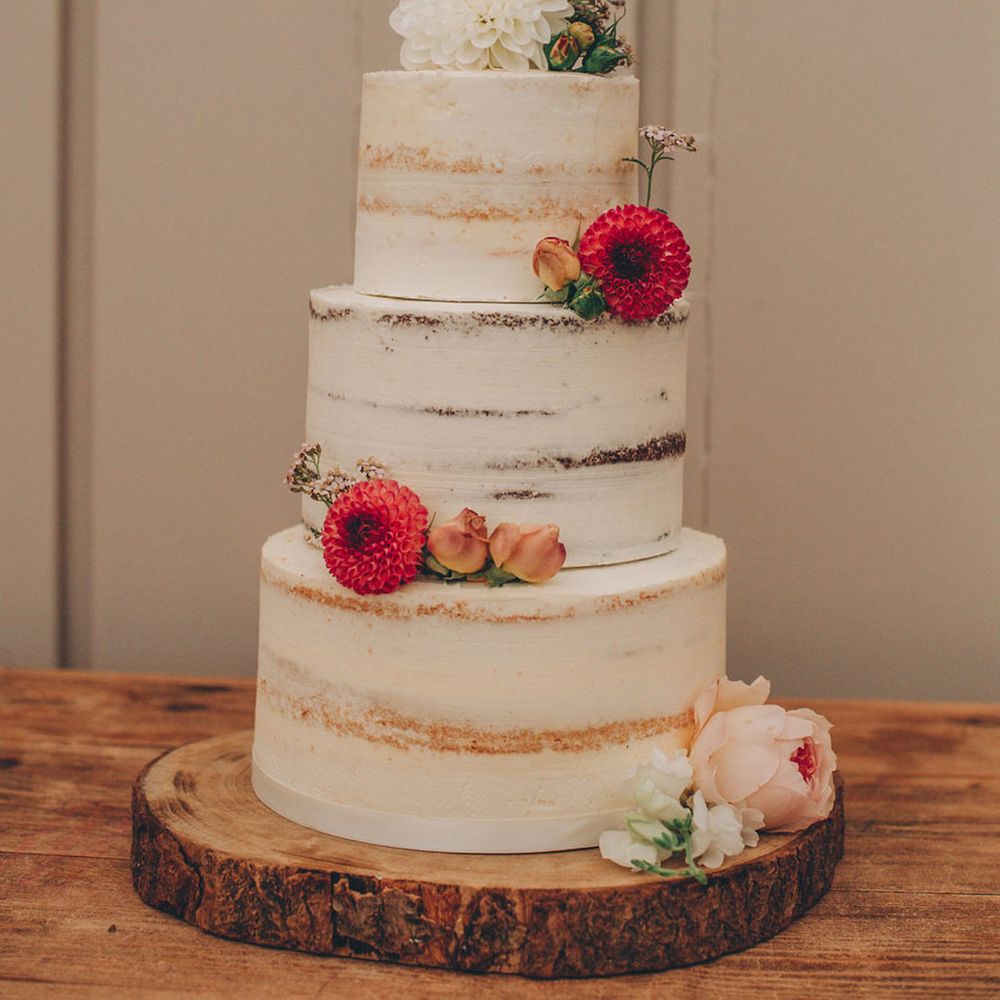 Semi naked wedding cake with flower decor