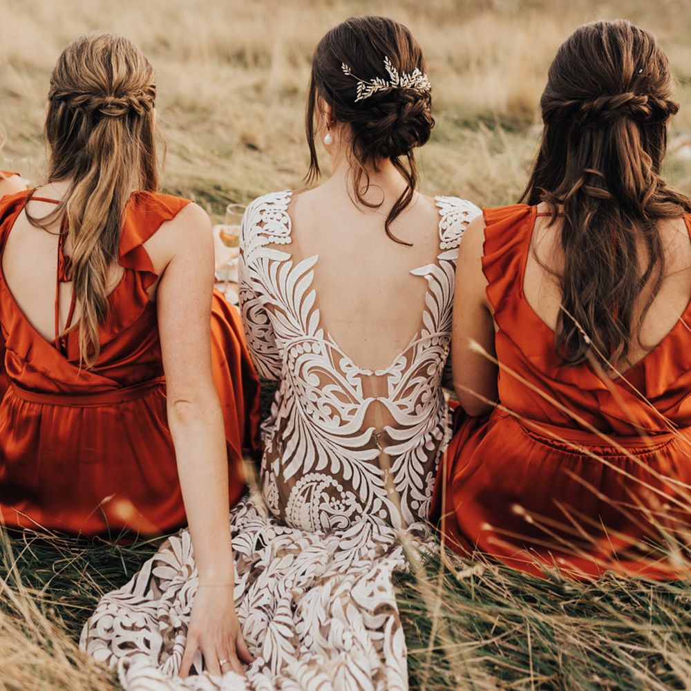 Bride & Bridal wedding hair up style with V neck back dresses 