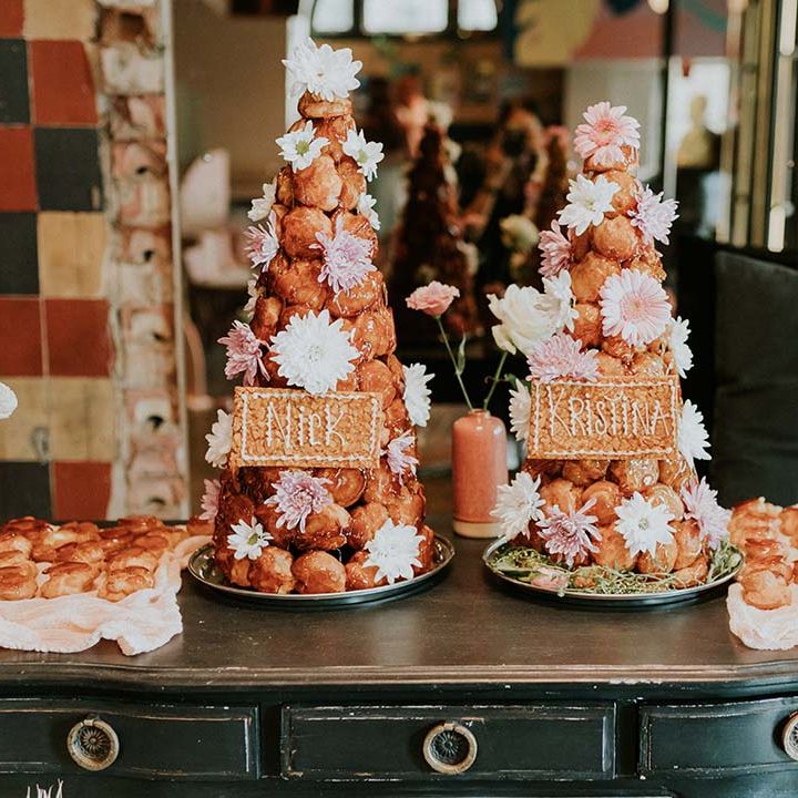 Croquembouche complete with flowers and personalised names in replacement of wedding cake