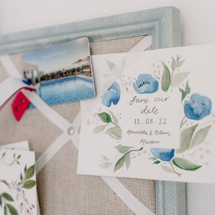 Wedding invited on white card complete with water colour illustration 