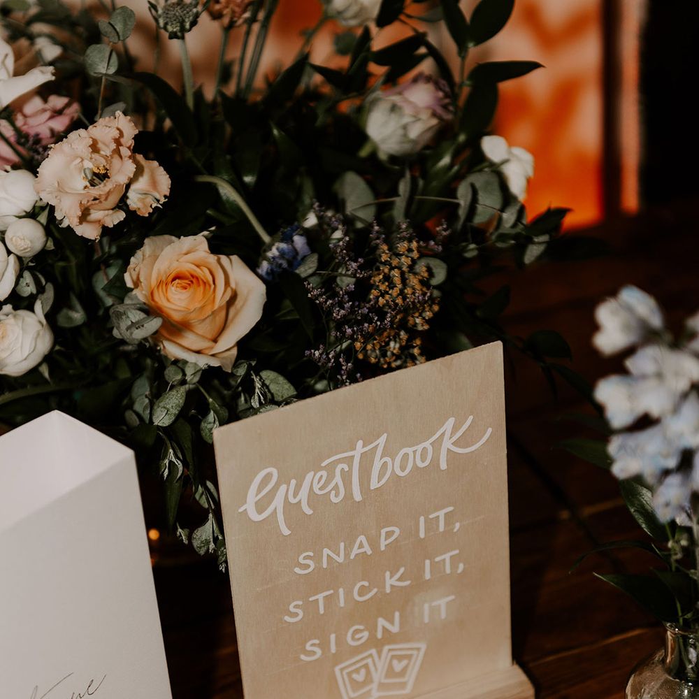 Polaroid wedding guest book with wooden guest book sign 