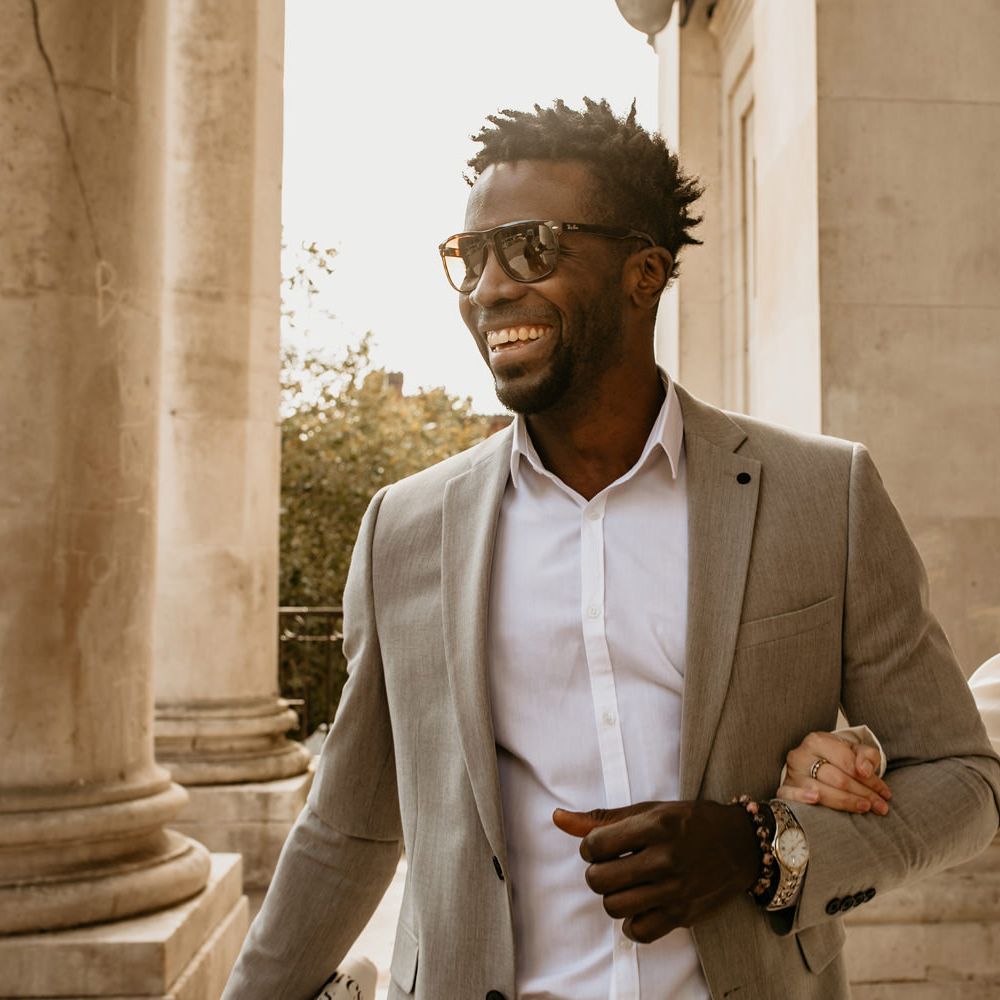 Groom in light grey suit, and white shirt for Portsmouth Guidhall elopement wedding 