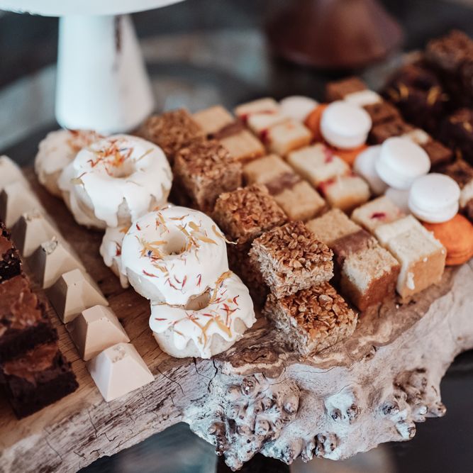 Mini doughnuts, macaroons, flapjacks and brownies for wedding dessert table 