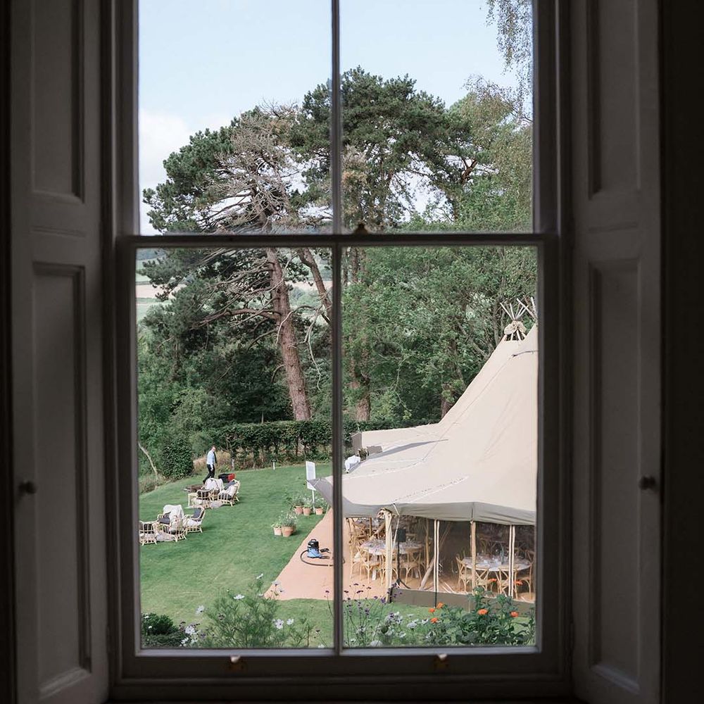 View from inside Georgian Bath home of the outdoor wedding and Buffalo Tipi reception area 