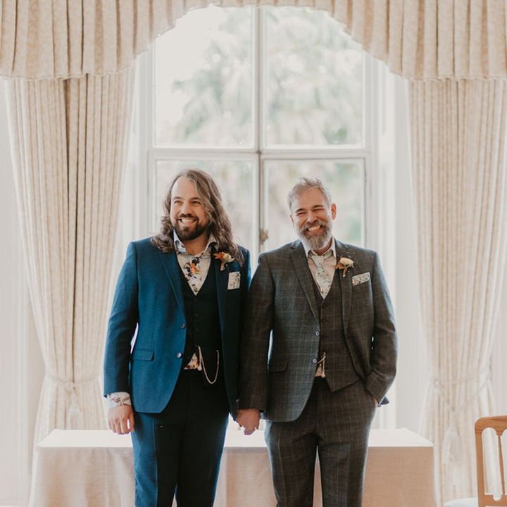 Groom in three piece blue suit and groom in tartan three piece suit complete with pocket watches 