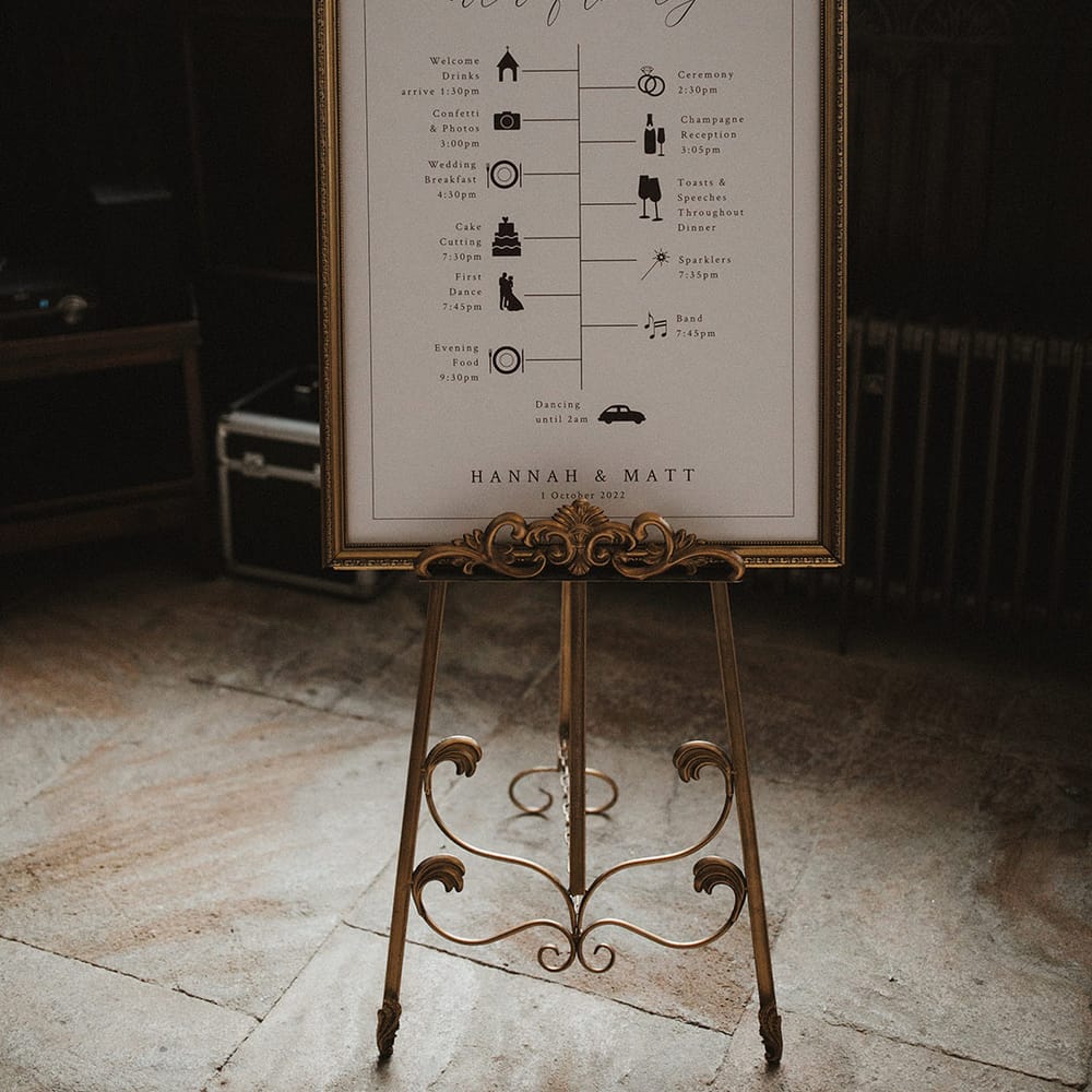 Personalised black and white wedding order of the day sign with gold vintage frame 
