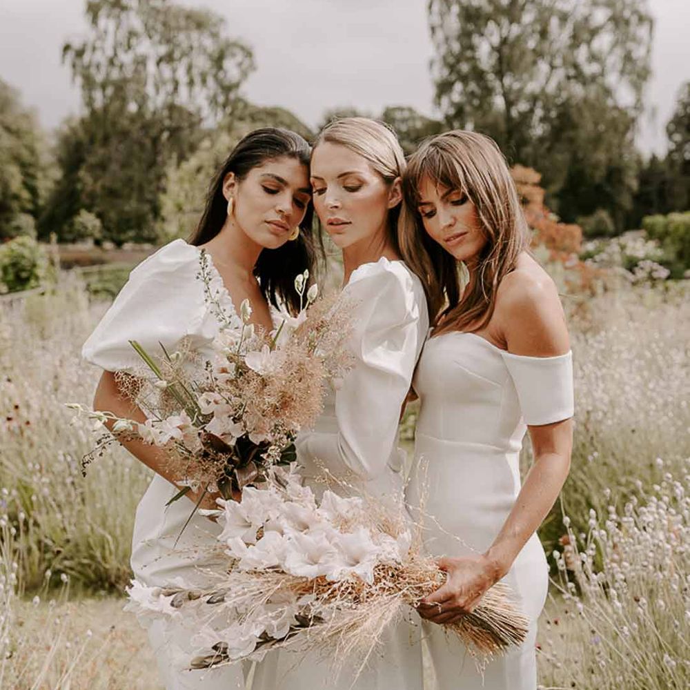 Bridesmaids wearing white bridesmaid dresses at Middleton Lodge - hen party ideas