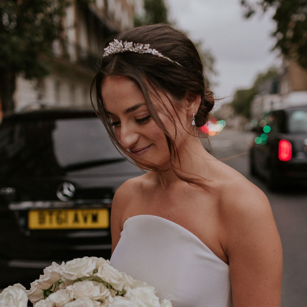 Stylish bride in Roland Mouret wedding dress with white bouquet 