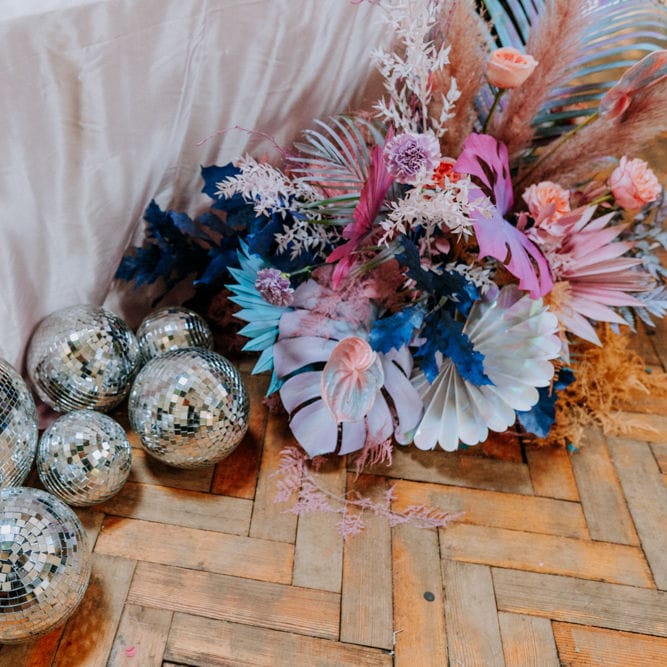 glitter balls and pastel flowers at festival wedding 